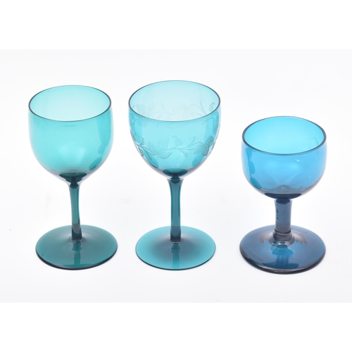 374 - An assortment of three 18th century & 19th century peacock blue & green crystal hand cut wine glasse... 