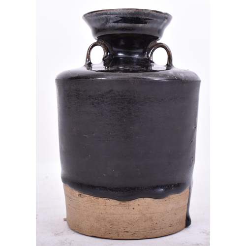 376 - A 19th century Japanese black glazed stoneware pottery wine ewer / jar. The vessel with flared rim, ... 