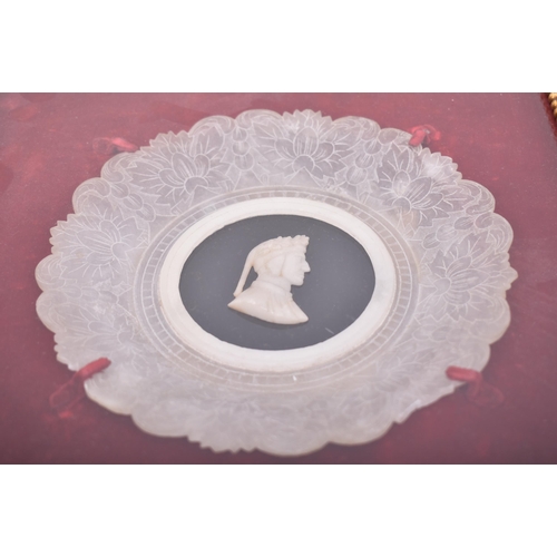 379 - A mid - late 19th century Victorian Grand Tour alabaster cameo plaque featuring a central depiction ... 