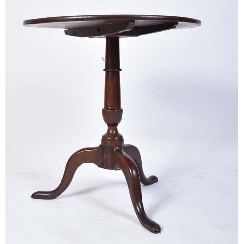 382 - A 18th century George III red walnut tilt top loo table. Raised on splayed legs with turned column t... 