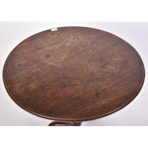 382 - A 18th century George III red walnut tilt top loo table. Raised on splayed legs with turned column t... 