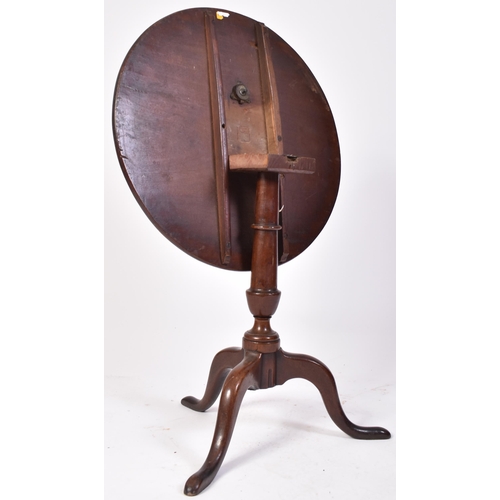 382 - A 18th century George III red walnut tilt top loo table. Raised on splayed legs with turned column t... 