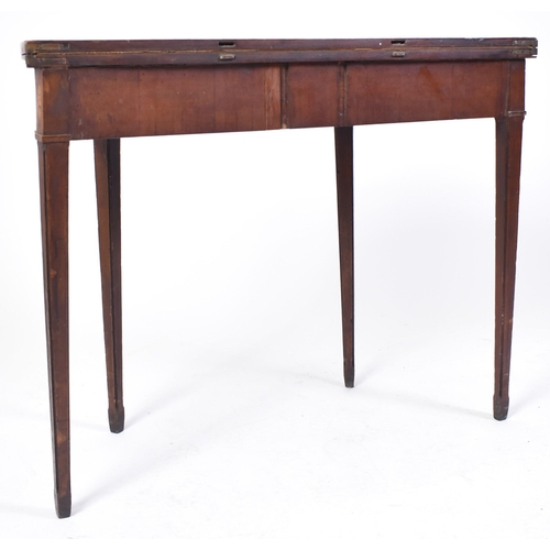 384 - An 18th century Inlaid mahogany George III mahogany games / card table. Raised on tapering legs with... 