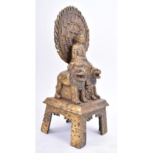 39 - A 20th century Tang style gilt bronze Buddha statue with two Fu dogs raised on a tall base with four... 