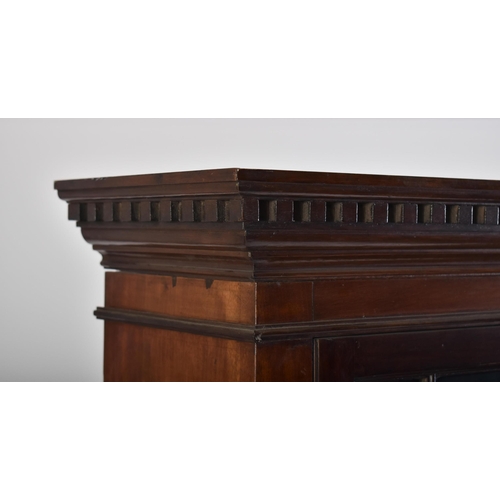 391 - An early 20th century Edwardian mahogany bookcase cabinet in the Chippendale taste. The bookcase hav... 