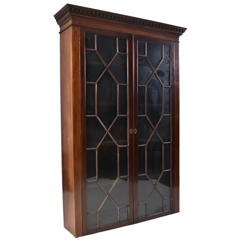 391 - An early 20th century Edwardian mahogany bookcase cabinet in the Chippendale taste. The bookcase hav... 