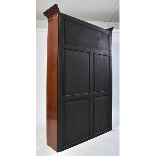 391 - An early 20th century Edwardian mahogany bookcase cabinet in the Chippendale taste. The bookcase hav... 