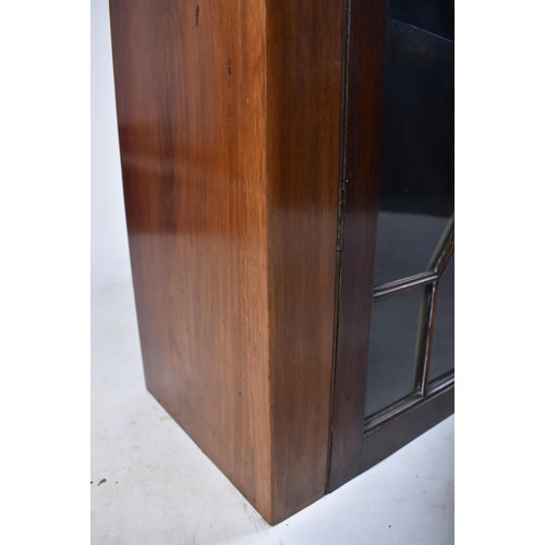 391 - An early 20th century Edwardian mahogany bookcase cabinet in the Chippendale taste. The bookcase hav... 