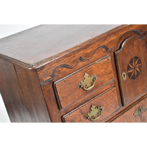 394 - A George II 18th century Scottish oak bachelor's chest of drawers. The chest having a chamfered edge... 