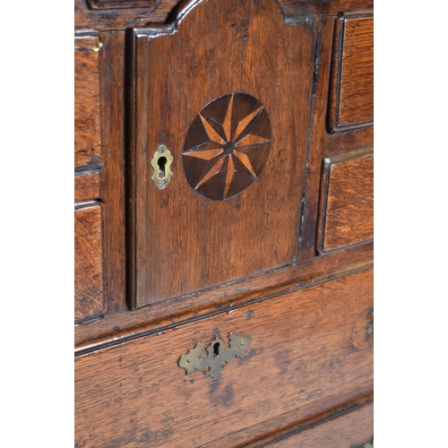 394 - A George II 18th century Scottish oak bachelor's chest of drawers. The chest having a chamfered edge... 