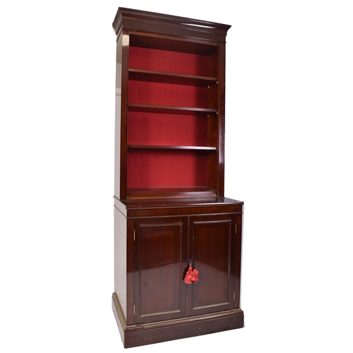 398 - A pair of tall early 20th century Victorian style mahogany bookcase cabinets. Each having a pediment... 