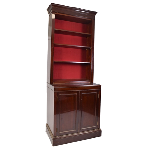 398 - A pair of tall early 20th century Victorian style mahogany bookcase cabinets. Each having a pediment... 