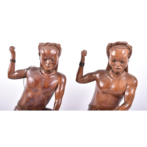 399 - A pair of early 20th century circa 1900s Oriental carved wood figures of tribal hunters with preys. ... 