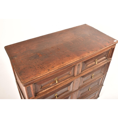 400 - A 17th century Jacobean commonwealth block fronted two part oak chest of drawers. The chest having a... 