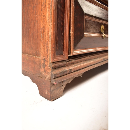 400 - A 17th century Jacobean commonwealth block fronted two part oak chest of drawers. The chest having a... 