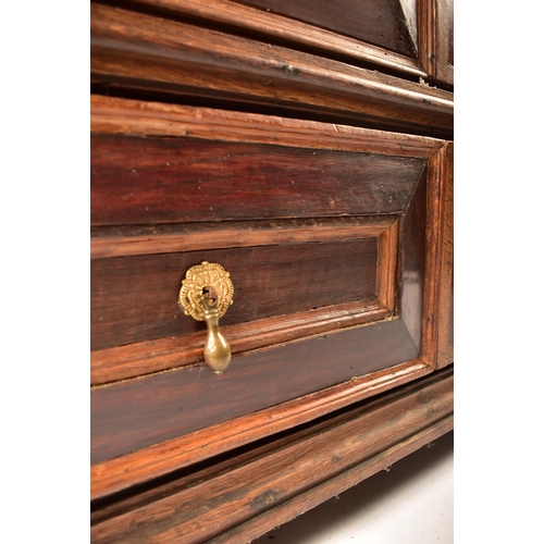 400 - A 17th century Jacobean commonwealth block fronted two part oak chest of drawers. The chest having a... 