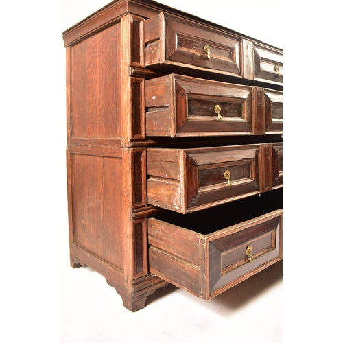 400 - A 17th century Jacobean commonwealth block fronted two part oak chest of drawers. The chest having a... 