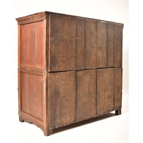 400 - A 17th century Jacobean commonwealth block fronted two part oak chest of drawers. The chest having a... 