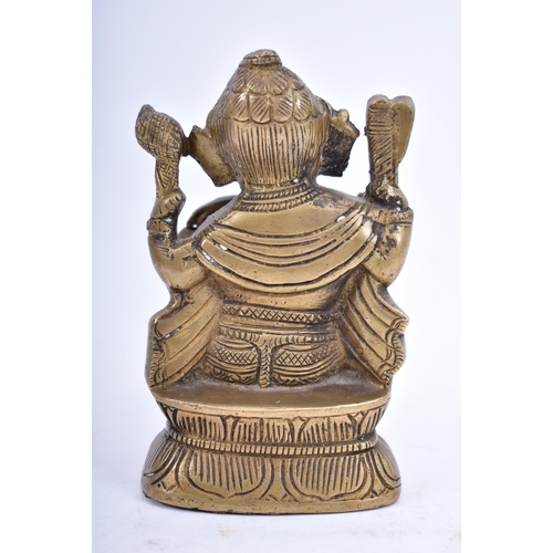 41 - An Indian/Hindi heavy bronze figure of Ganesha/Ganesh. The figurine modelled holding a bowl of sweet... 