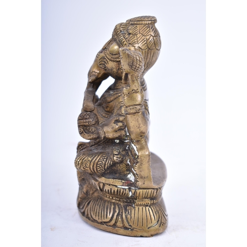 41 - An Indian/Hindi heavy bronze figure of Ganesha/Ganesh. The figurine modelled holding a bowl of sweet... 