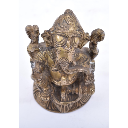 41 - An Indian/Hindi heavy bronze figure of Ganesha/Ganesh. The figurine modelled holding a bowl of sweet... 