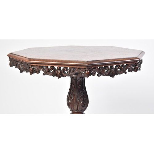 43 - A 19th century Victorian heavily carved mahogany occasional table / lamp table. The table having an ... 