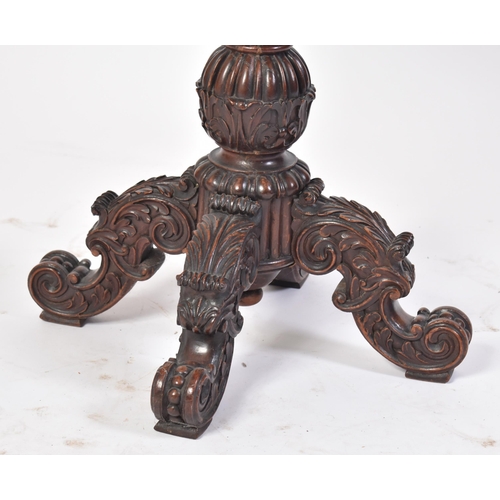 43 - A 19th century Victorian heavily carved mahogany occasional table / lamp table. The table having an ... 