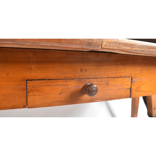 45 - An early 20th century French continental fruitwood refectory farmhouse extending dining table. The t... 