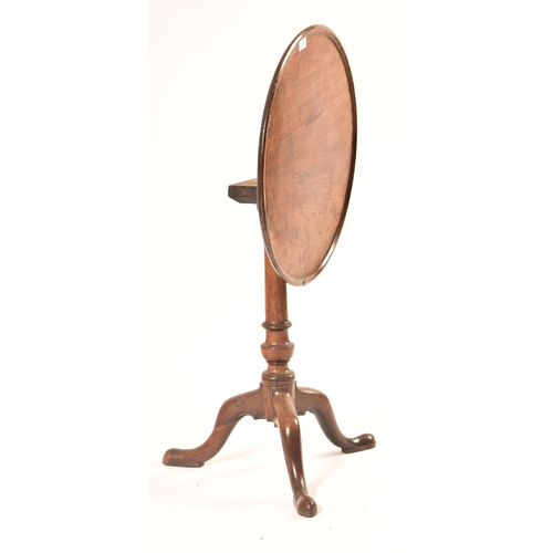 454 - A 19th century Victorian mahogany tilt top wine side table. The table top circular mounted on three ... 