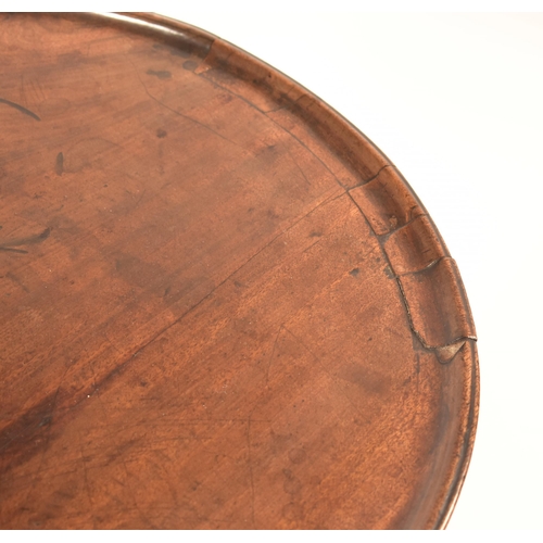 454 - A 19th century Victorian mahogany tilt top wine side table. The table top circular mounted on three ... 