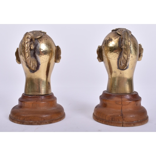 456 - A pair of 20th century Indian Hindu cast brass Gauri / Gowri idol heads on wooden stands. Each head ... 