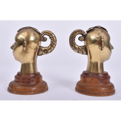 456 - A pair of 20th century Indian Hindu cast brass Gauri / Gowri idol heads on wooden stands. Each head ... 