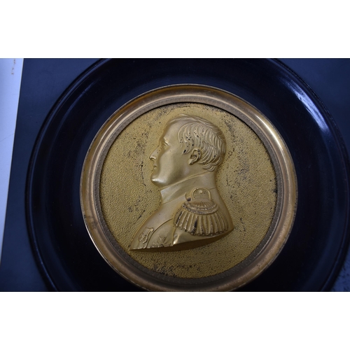 458 - A pair of early 20th century French gilt metal miniature in relief portraits of Napoleon Bonaparte &... 