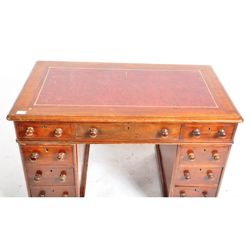 459 - A Victorian 19th century stained mahogany twin pedestal desk. The kneehole desk having a red leather... 