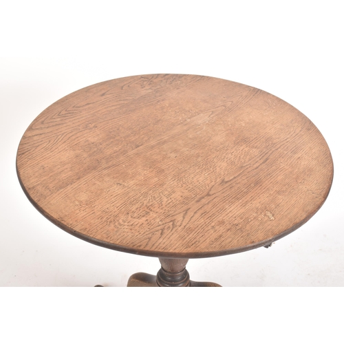 463 - A Victorian 19th century oak tilt top tripod side coffee table. The table having a circular tilt top... 