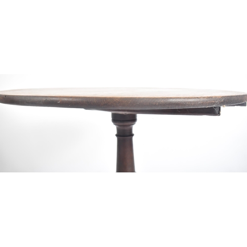 463 - A Victorian 19th century oak tilt top tripod side coffee table. The table having a circular tilt top... 