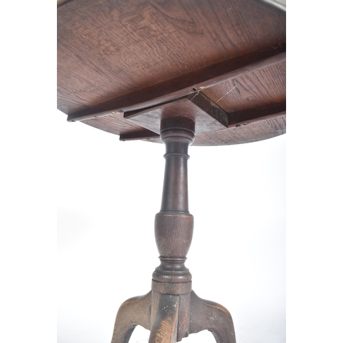 463 - A Victorian 19th century oak tilt top tripod side coffee table. The table having a circular tilt top... 