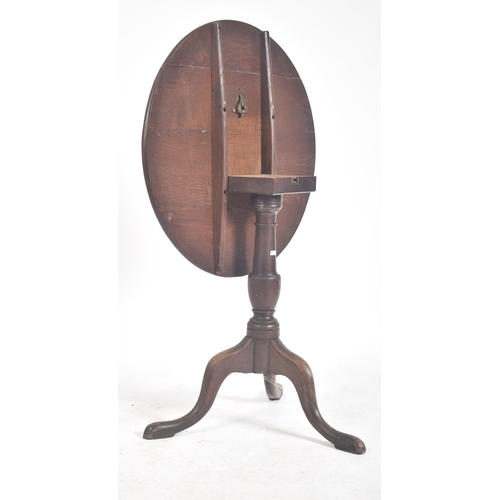 463 - A Victorian 19th century oak tilt top tripod side coffee table. The table having a circular tilt top... 