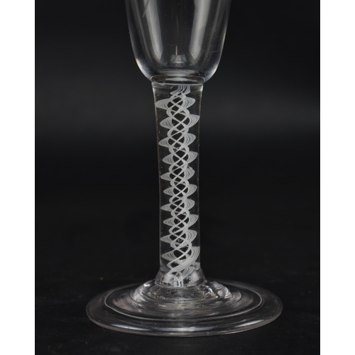 48 - An 18th century opaque twist stem ale glass engraved with hop flower and barley ears raised on a con... 