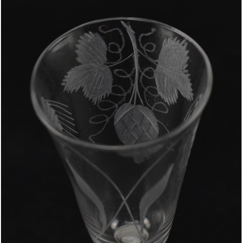 48 - An 18th century opaque twist stem ale glass engraved with hop flower and barley ears raised on a con... 