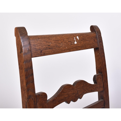 486 - An 18th century country oak George II child's chair of North Country origin. Raised on stile legs wi... 