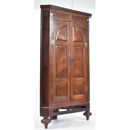 488 - A Victorian 19th century corner cupboard cabinet. The cupboard having a pediment top with dentil dec... 