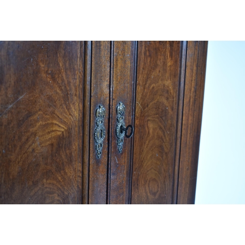 488 - A Victorian 19th century corner cupboard cabinet. The cupboard having a pediment top with dentil dec... 