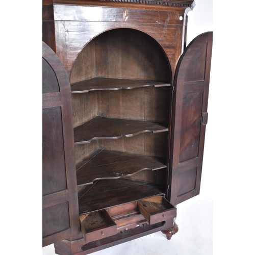 488 - A Victorian 19th century corner cupboard cabinet. The cupboard having a pediment top with dentil dec... 