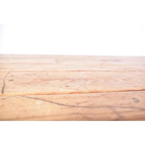 490 - A large early 20th century pine wood refectory farmhouse dining table. The table having a rectangula... 