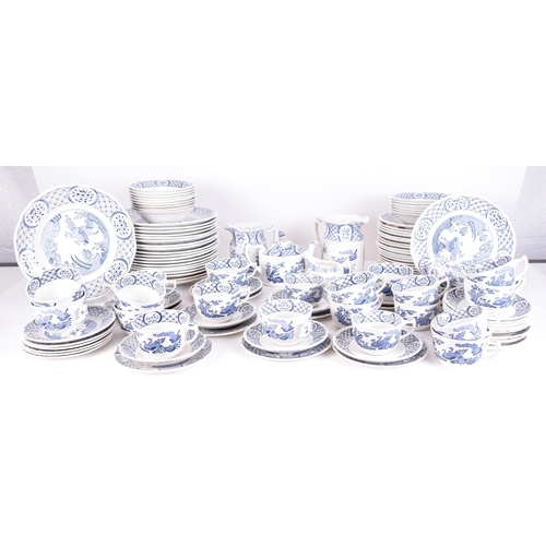 54 - A Masons ' Old Chelsea ' pattern blue and white dinner service. The service comprises dinner plates,... 