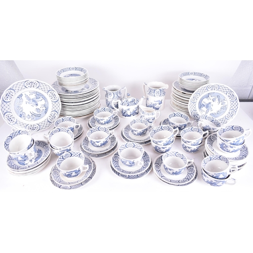 54 - A Masons ' Old Chelsea ' pattern blue and white dinner service. The service comprises dinner plates,... 