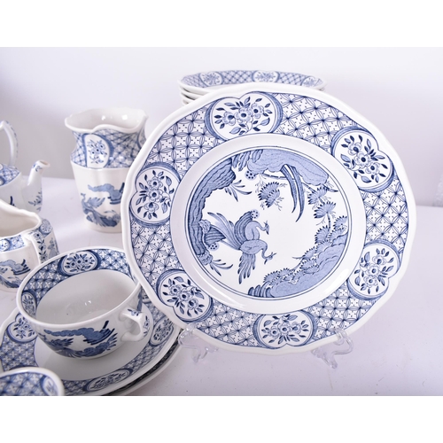 54 - A Masons ' Old Chelsea ' pattern blue and white dinner service. The service comprises dinner plates,... 