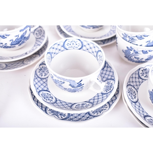 54 - A Masons ' Old Chelsea ' pattern blue and white dinner service. The service comprises dinner plates,... 