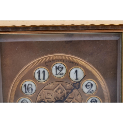 56 - A 20th century brass repeating carriage clock. The desk clock with brass edges & handle and bevelled... 